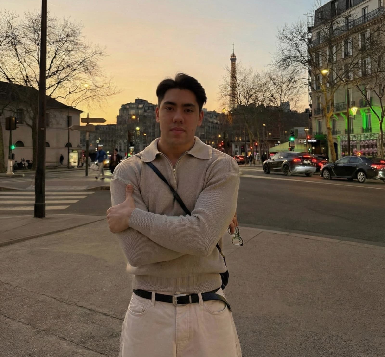 Matthew Stevens standing in Paris at sunset.