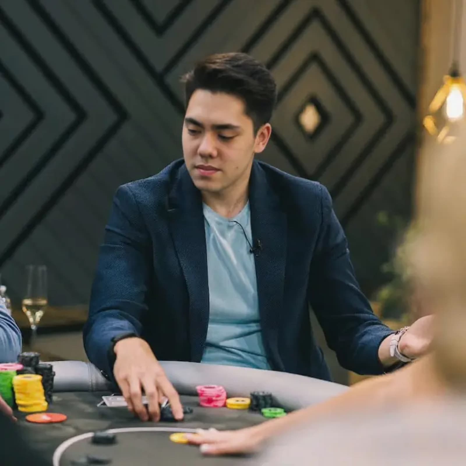 Matthew Stevens playing cards at a table.